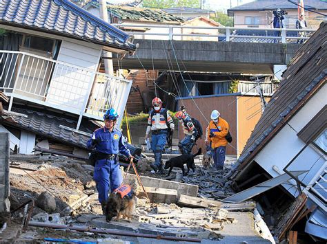 Rescuers race against time in search for survivors in Japan after powerful quakes leave 65 dead
